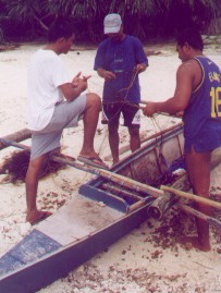 Balicasa Island boatmen with tangle net